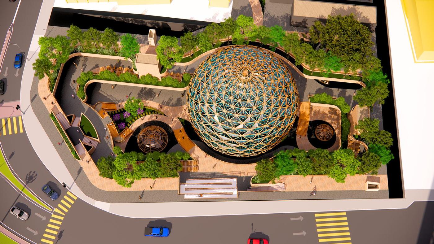 Aerial render of Penang's Pearl: a lattice glass dome set in a terraced urban park at a street corner