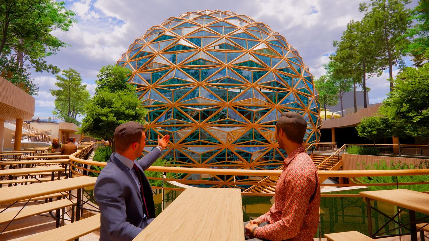 Two people on a timber terrace beside the lattice glass dome