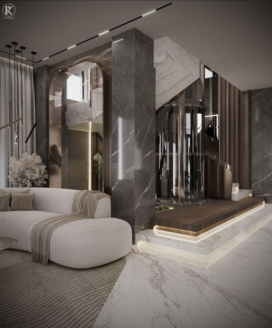 Glass home lift beside a seating area