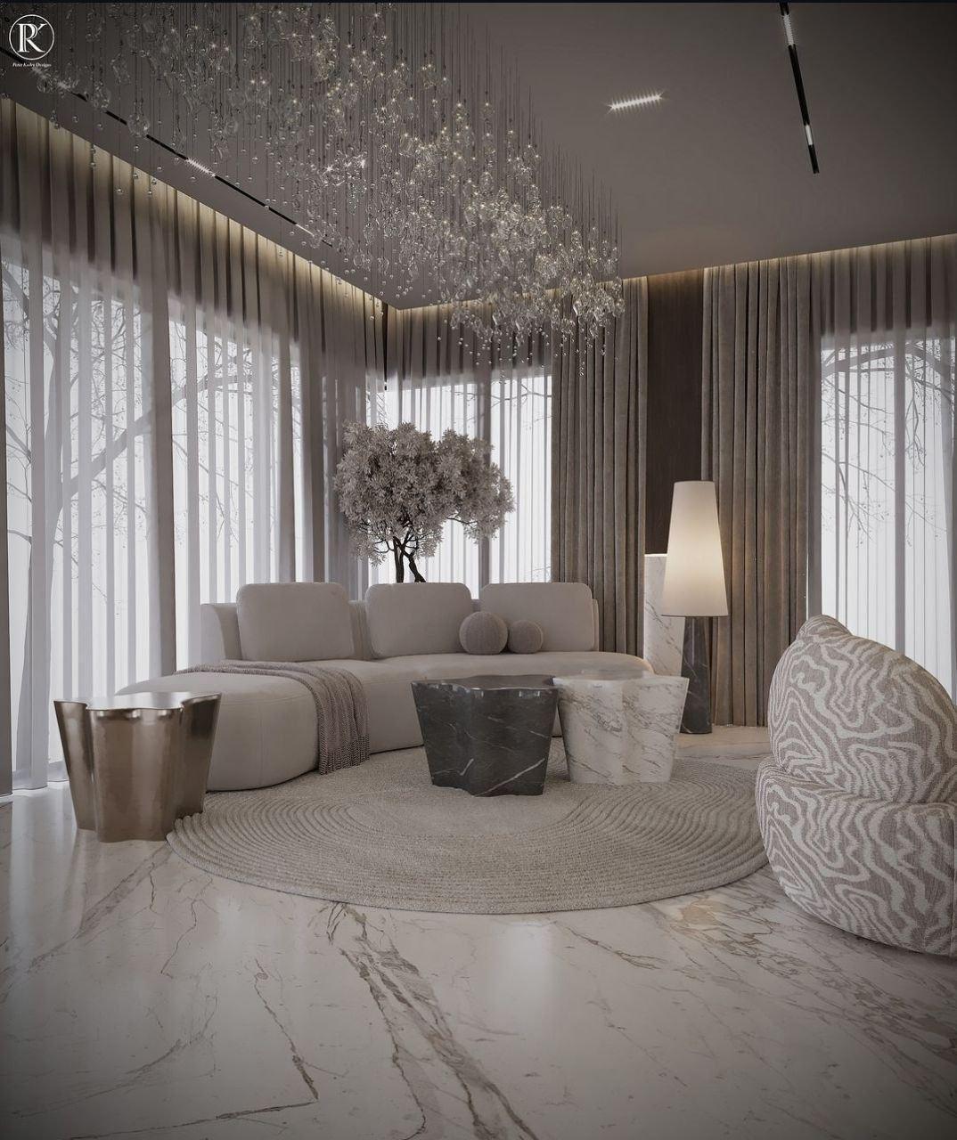 Living room with curved sofa and floor-to-ceiling sheer curtains