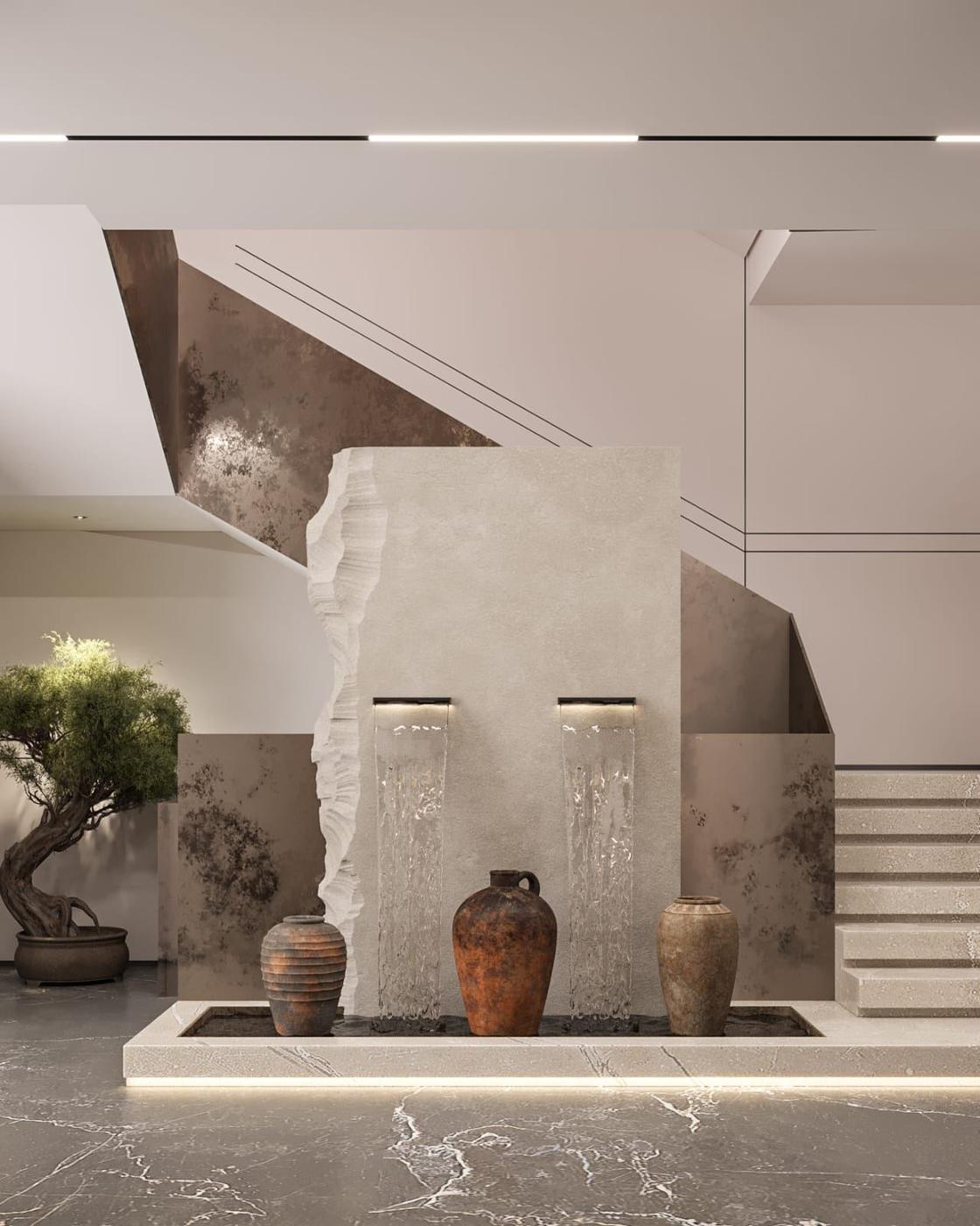 Stair hall with a carved stone water feature and clay pots